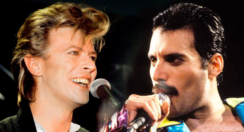 David Bowie and Freddie Mercury, each singing into a microphone, side by side.
